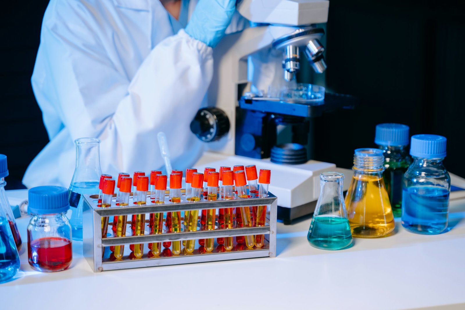 Scientist mixing chemical liquids in the chemistry lab. Researcher working